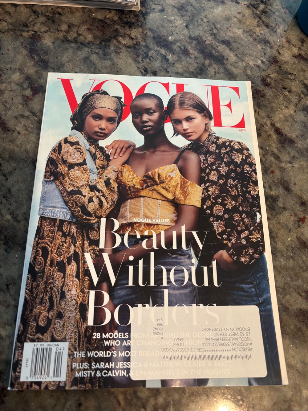 Vogue Cover Featuring Models in Yellow, Black and Floral Accents